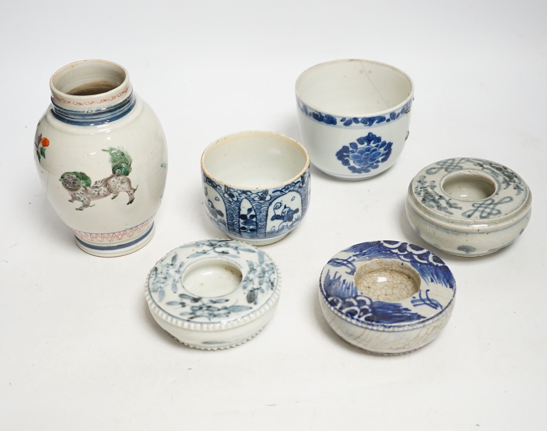 A group of Chinese ceramics, 17th/18th century, to include a famille verte mug (lacking handle) two U shaped bowls and three blue and white brush washers, largest 14cm high (a.f.)
